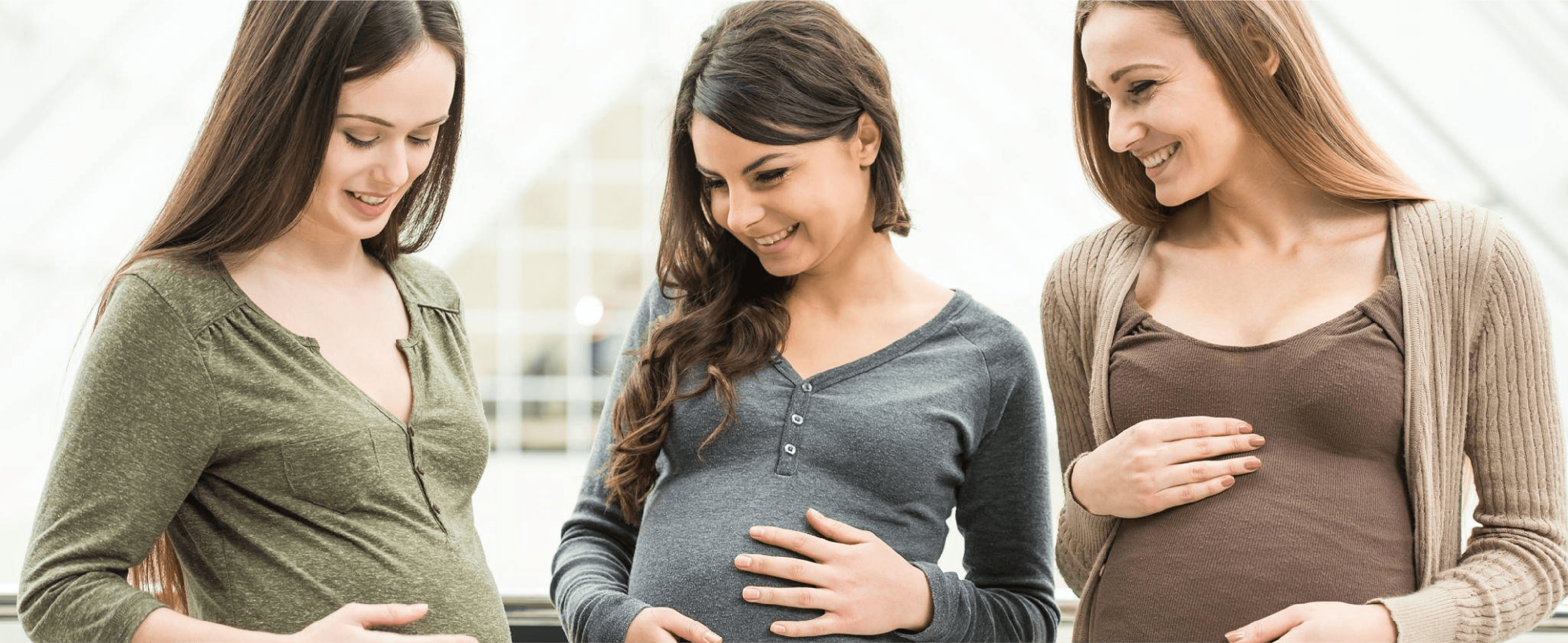 3 pregnant women standing together